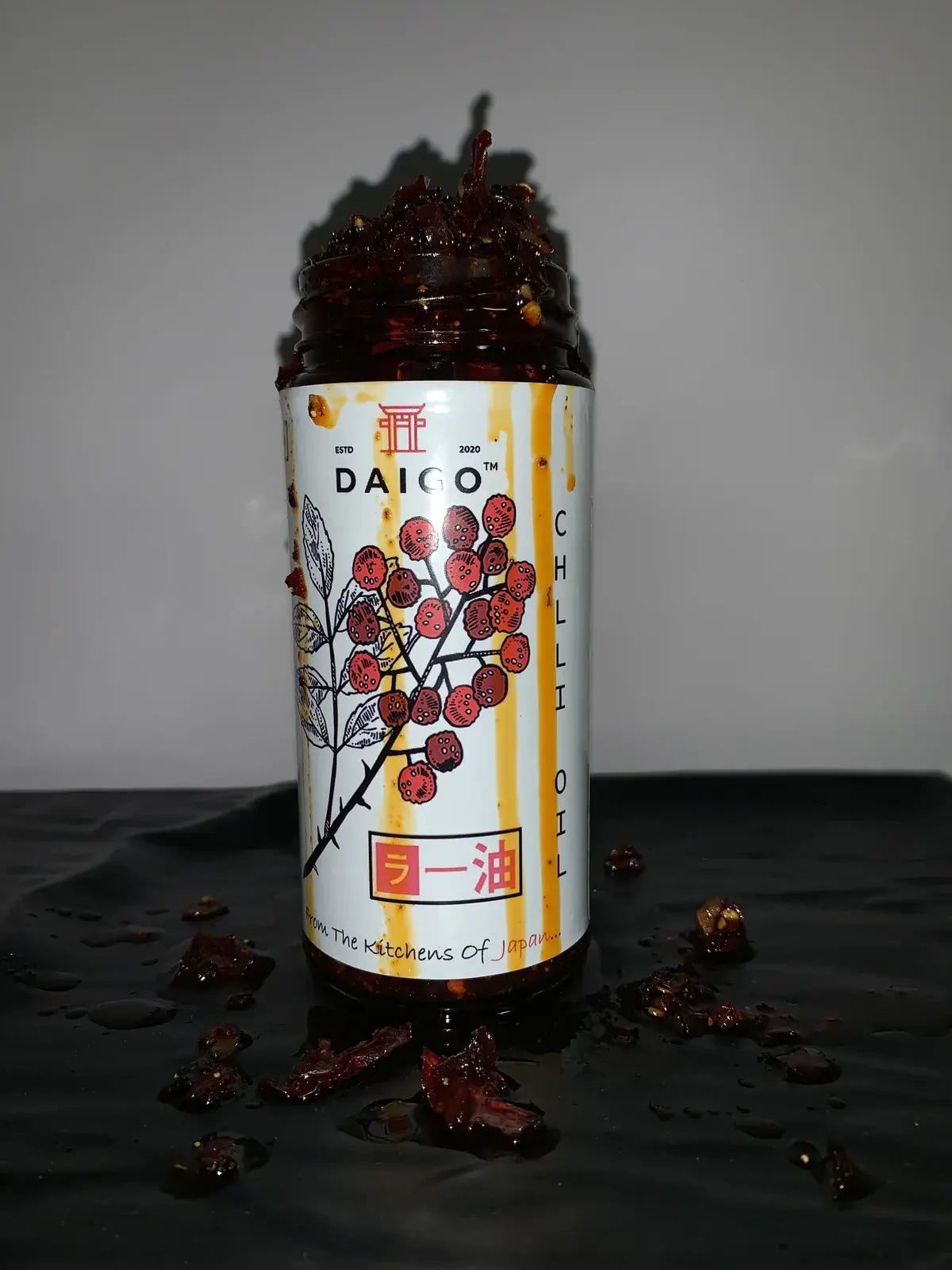 Behind the scenes of a marketing shoot, the hero jar with the oil on show.